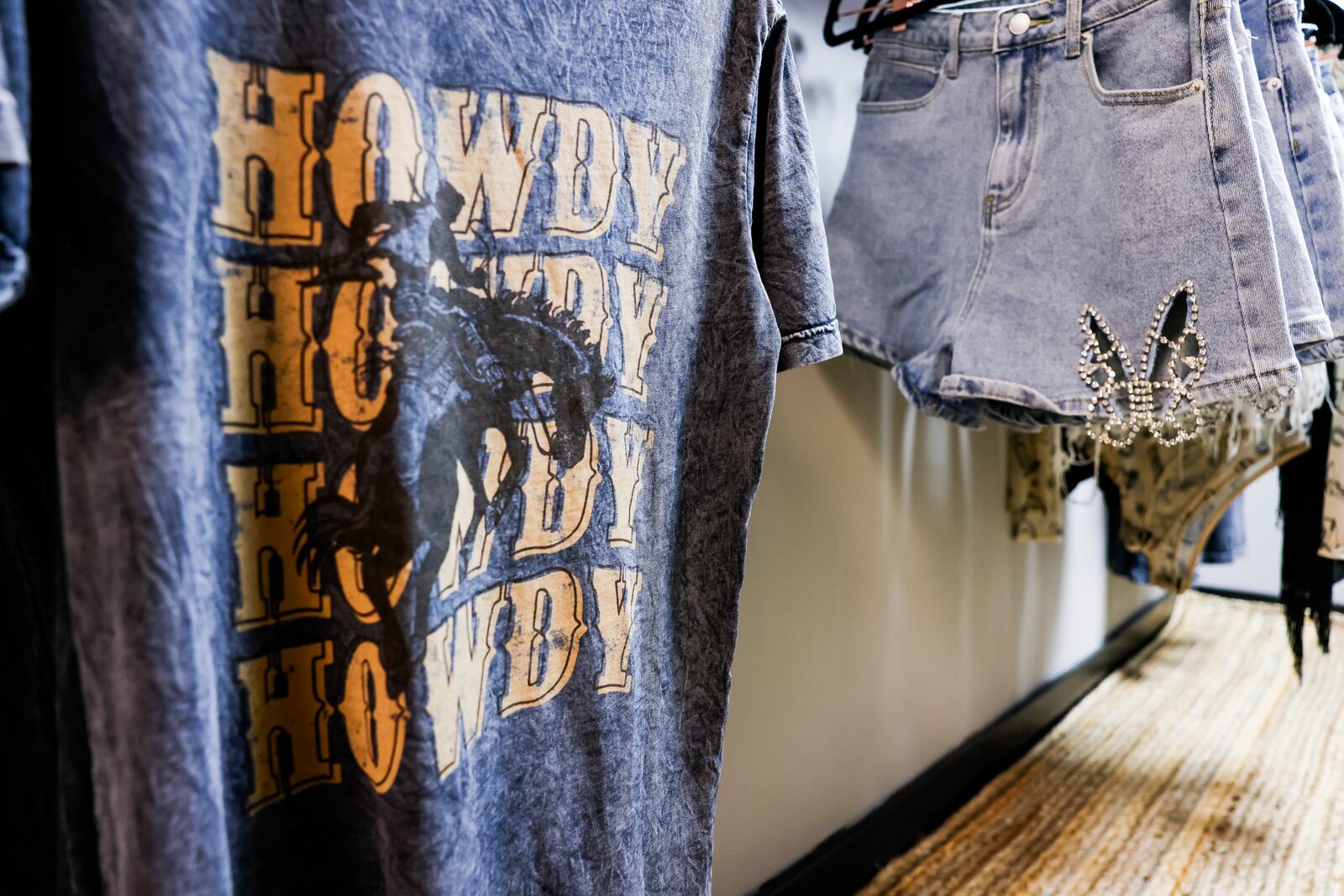 Bourbon and Fire will open their new storefront Wednesday, June 28 on Main Street in Hamilton. The store features custom laser engraved bourbon barrel lid games and decor, mixers, cigars and more. The back of the shop has a curated clothing boutique. NICK GRAHAM/STAFF