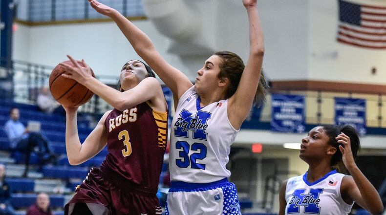 Julia Nunn of Ross puts up a shot while being defended by Hamilton’s Olivia Matthews during their game Jan. 8 at the Hamilton Athletic Center. The host Big Blue won 61-43. NICK GRAHAM/STAFF