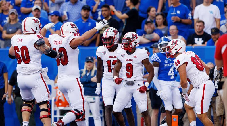 Miami (Ohio) running back Tyre Shelton (9) celebrates with teammates after scoring a touchdown during the first half of the team's NCAA college football game against Kentucky in Lexington, Ky., Saturday, Sept. 3, 2022. (AP Photo/Michael Clubb)