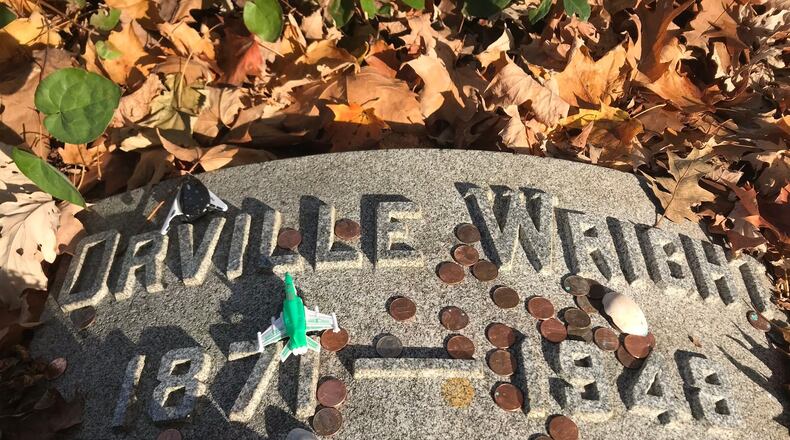 The Wright Brothers grave site in Woodland Cemetery is often found with mementos and other souvenirs left by visitors.