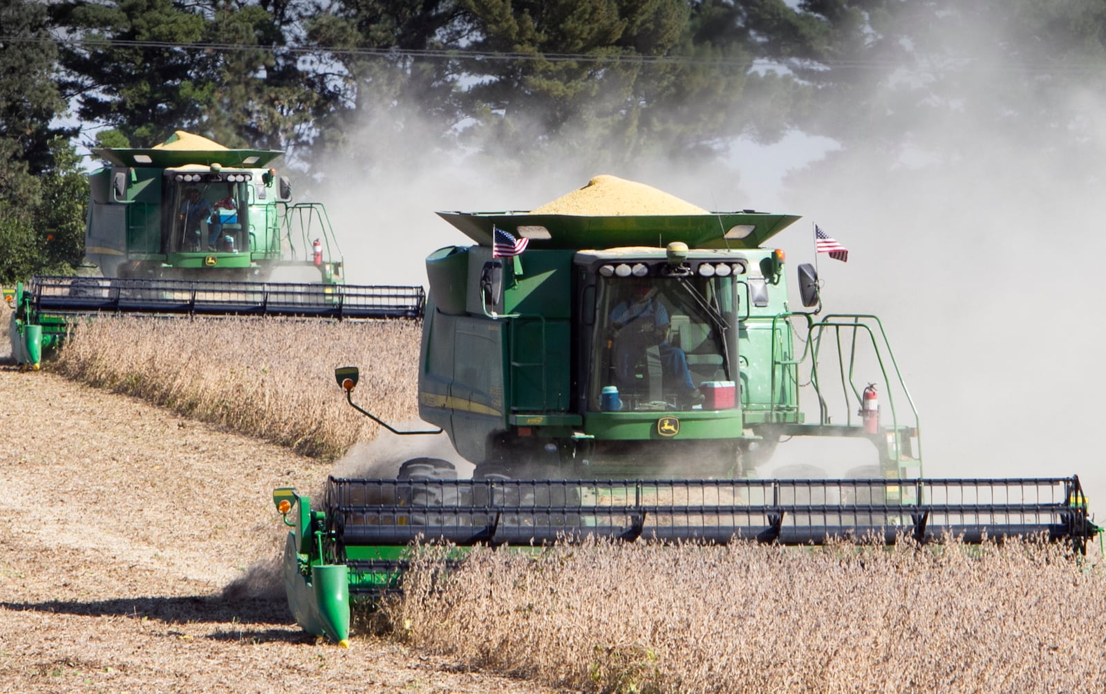 FILE - Soy beans are harvested near Plattsmouth, Neb., Oct. 6, 2010. (AP Photo/Nati Harnik, File)