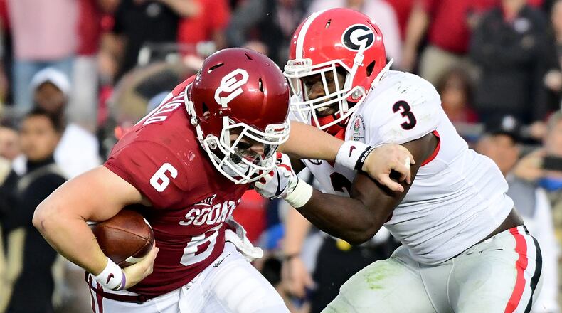 PASADENA, CA - JANUARY 01: Quarterback Baker Mayfield #6 of the Oklahoma Sooners looks to avoid a sack by linebacker Roquan Smith #3 of the Georgia Bulldogs in the second half in the 2018 College Football Playoff Semifinal at the Rose Bowl Game presented by Northwestern Mutual at the Rose Bowl on January 1, 2018 in Pasadena, California. (Photo by Harry How/Getty Images)
