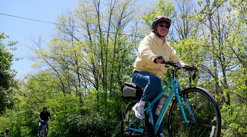 The city of Oxford has been awarded $2.76 million to complete Phase 5 of its multi-phase Oxford Area Trails project to create a 12-mile loop around the city. Pictured are cyclists on the multi-use trail that opened in the city of Oxford in 2017. FILE