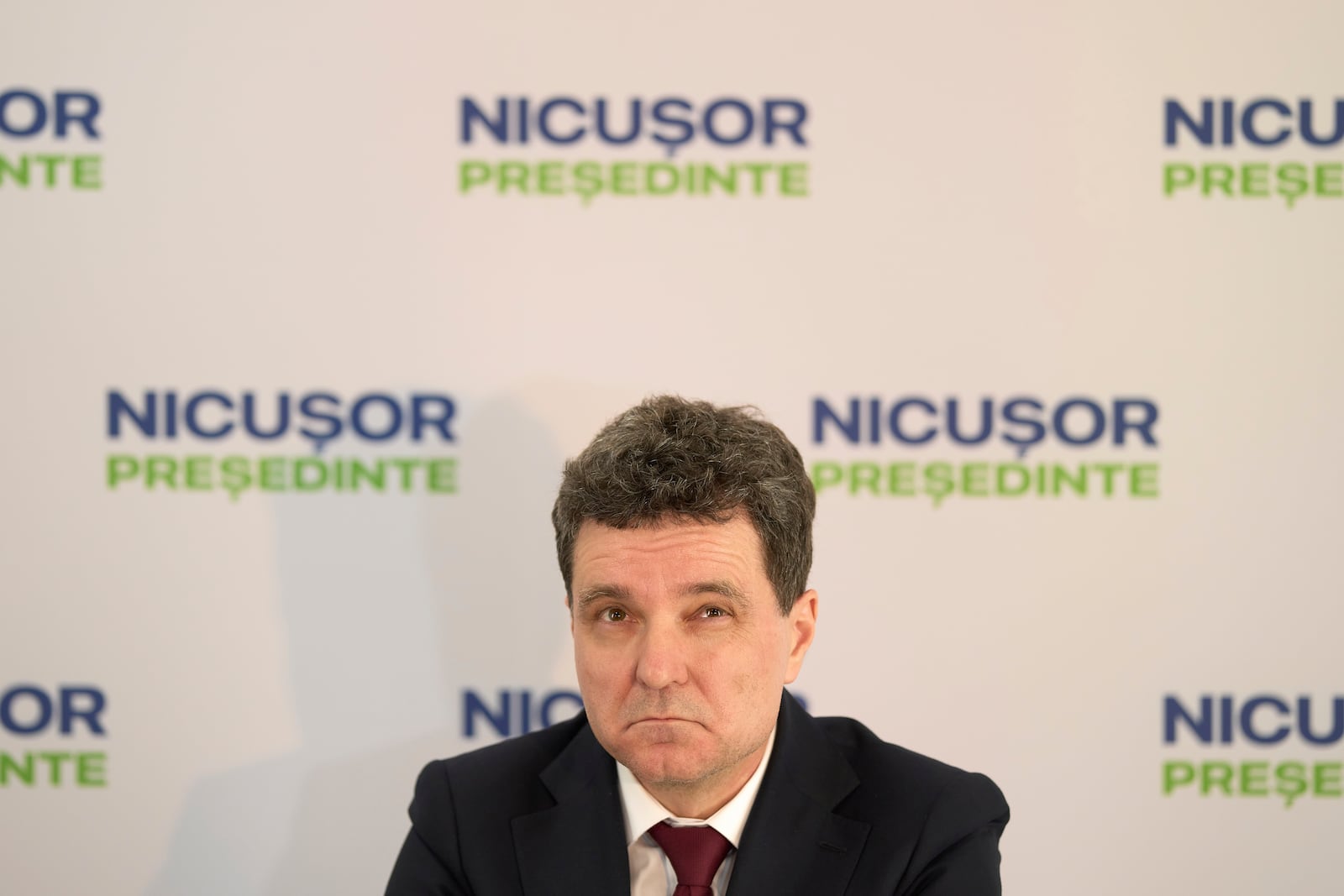 Presidential candidate Nicusor Dan looks up during a press conference in Bucharest, Romania, Thursday, May 1, 2025. (AP Photo/Vadim Ghirda)