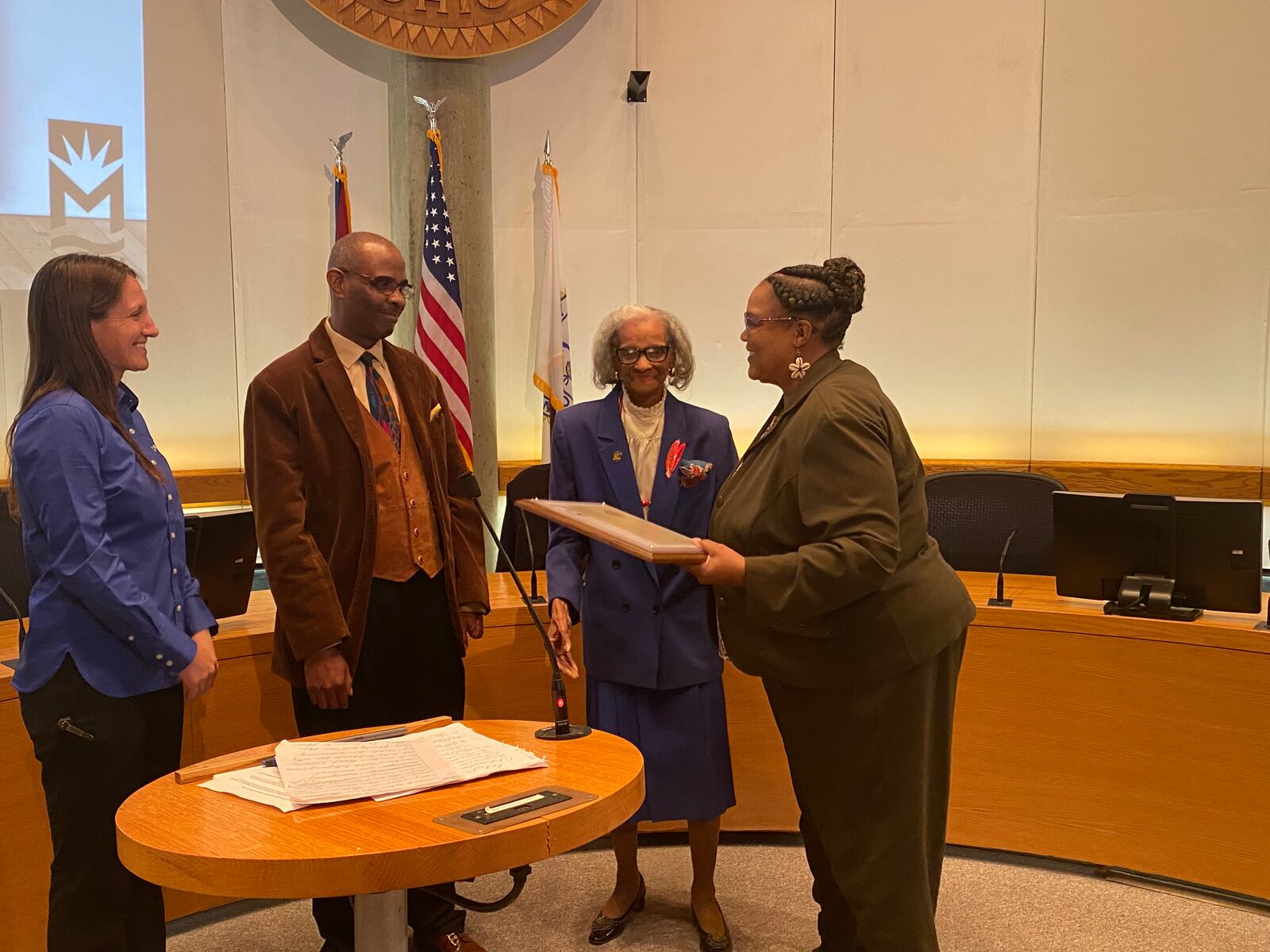 Celeste Didlick-Davis, right, accepts the 14th Robert "Sonny" Hill Jr. Humanitarian Award from, left, Middletown Mayor Nicole Condrey, Robbie Hill and Pat Hill. She received the award at the last city council meeting. RICK McCRABB/STAFF