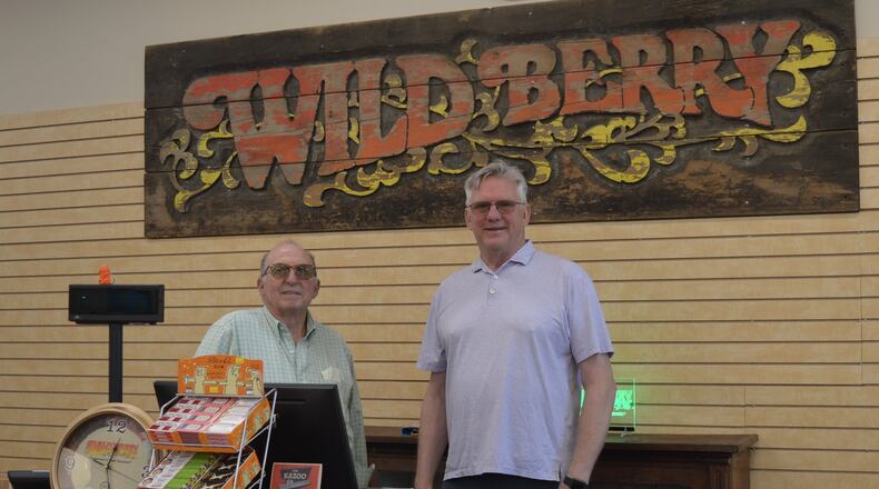 Wild Berry business owners Marc Biales (left) and Roger Atkin are shown behind the counter in their new incense store at 5465 College Corner Pike, in front of the incense factory. The store is open to the public but is also set up with all of their incense displays so potential vendors can see how they look in operation. CONTRIBUTED/BOB RATTERMAN