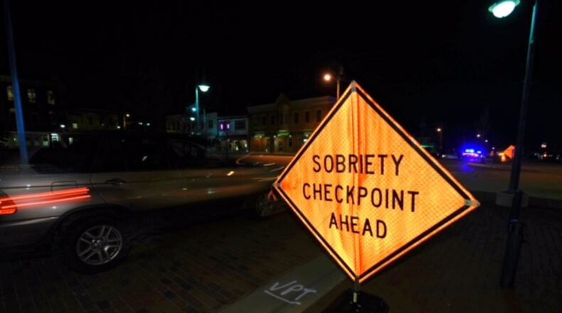 FILE: The Butler County OVI Task Force works a sobriety checkpoint in Oxford March 16, 2017. NICK GRAHAM/STAFF