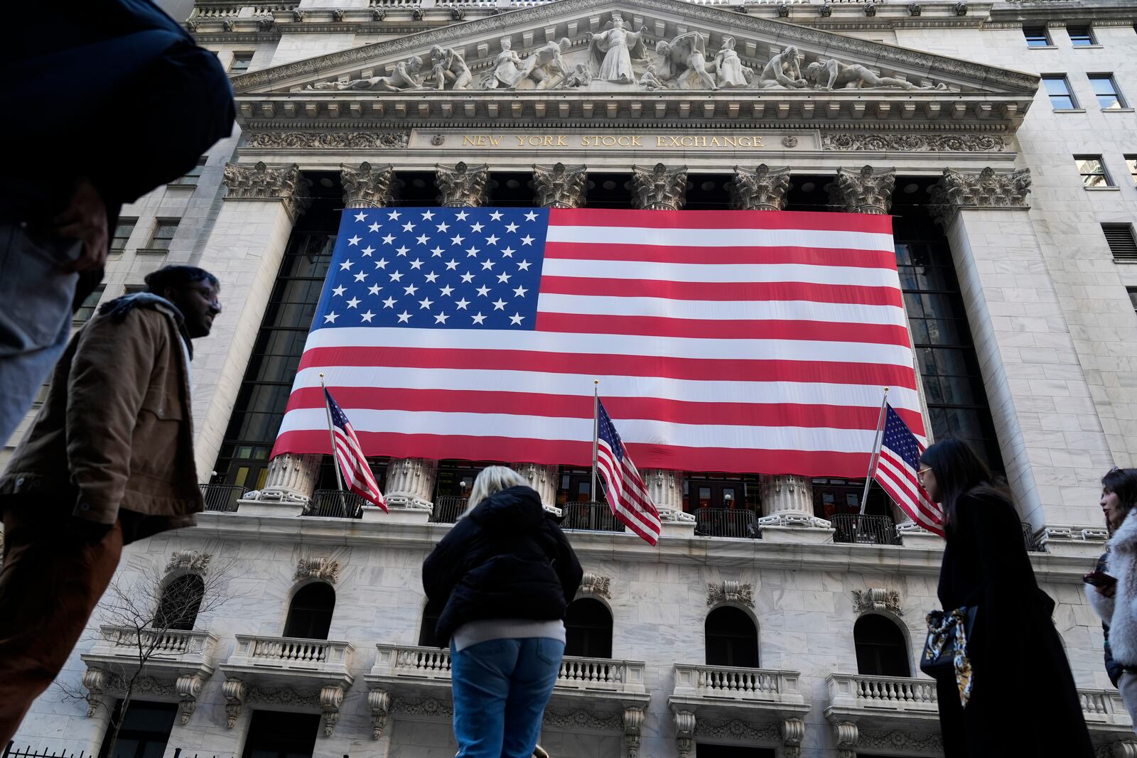 FILE - An American flag is displayed on the New York Stock Exchange in New York, Monday, Feb. 24, 2025. (AP Photo/Seth Wenig, File)