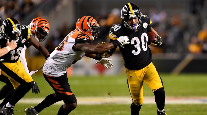 PITTSBURGH, PA - DECEMBER 30: James Conner #30 of the Pittsburgh Steelers carries the ball against the Cincinnati Bengals in the third quarter during the game at Heinz Field on December 30, 2018 in Pittsburgh, Pennsylvania. (Photo by Joe Sargent/Getty Images)