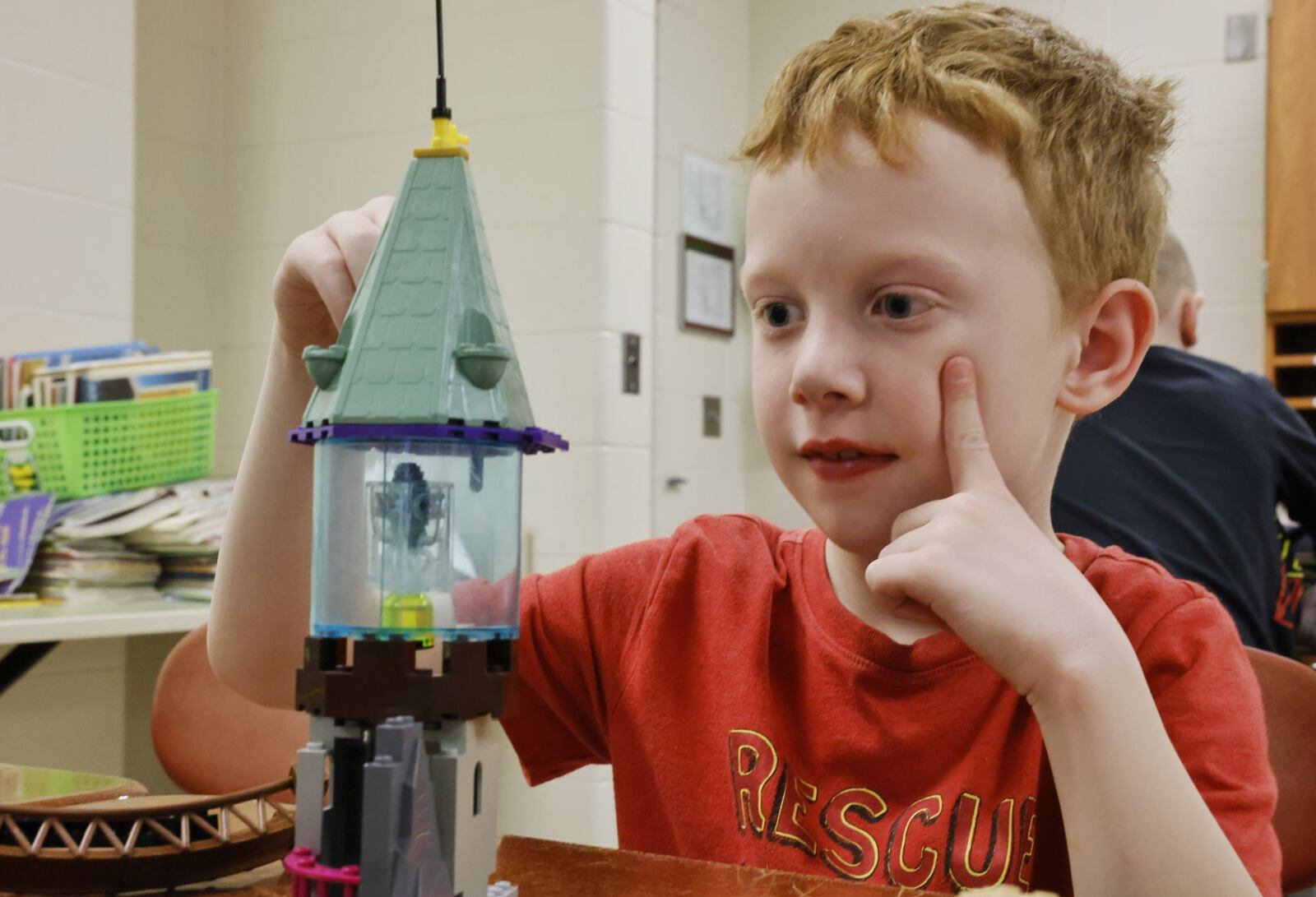 Benjamin Walsh, 7, builds a tower during Lego club after school Thursday, March 23, 2023 at Madison Elementary School. Madison offered multiple after school clubs with many filled to capacity. NICK GRAHAM/STAFF