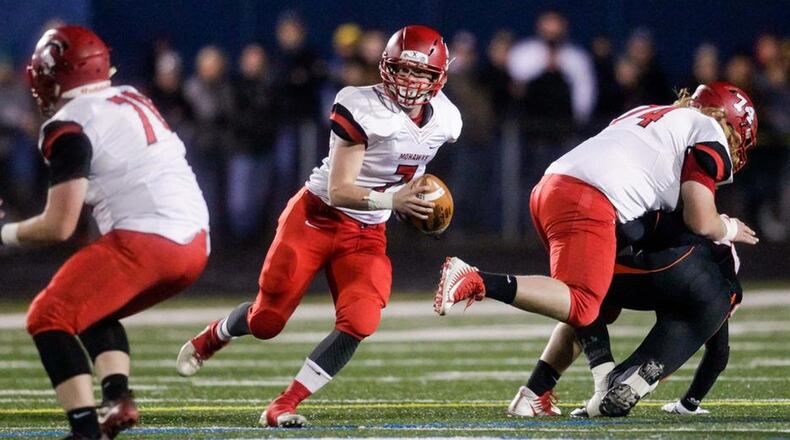 Madison quarterback Mason Whiteman looks up the field during a Division V state semifinal against Wheelersburg on Nov. 24, 2017, at Herrnstein Field in Chillicothe. Wheelersburg rallied from a 10-0 deficit to win 15-10. NICK GRAHAM/STAFF