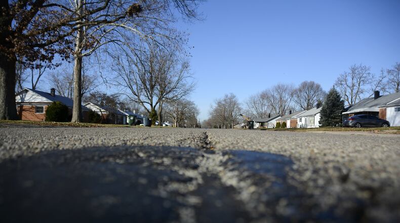 Roads, water and sewer lines, and sidewalks are among the infrastructure projects that will be done this spring, summer and fall. Walter Avenue is one of four streets that have a deterorating concrete base the city will replace this coming year, and is one of several road projects the city will undertake in 2017. MICHAEL D. PITMAN/STAFF