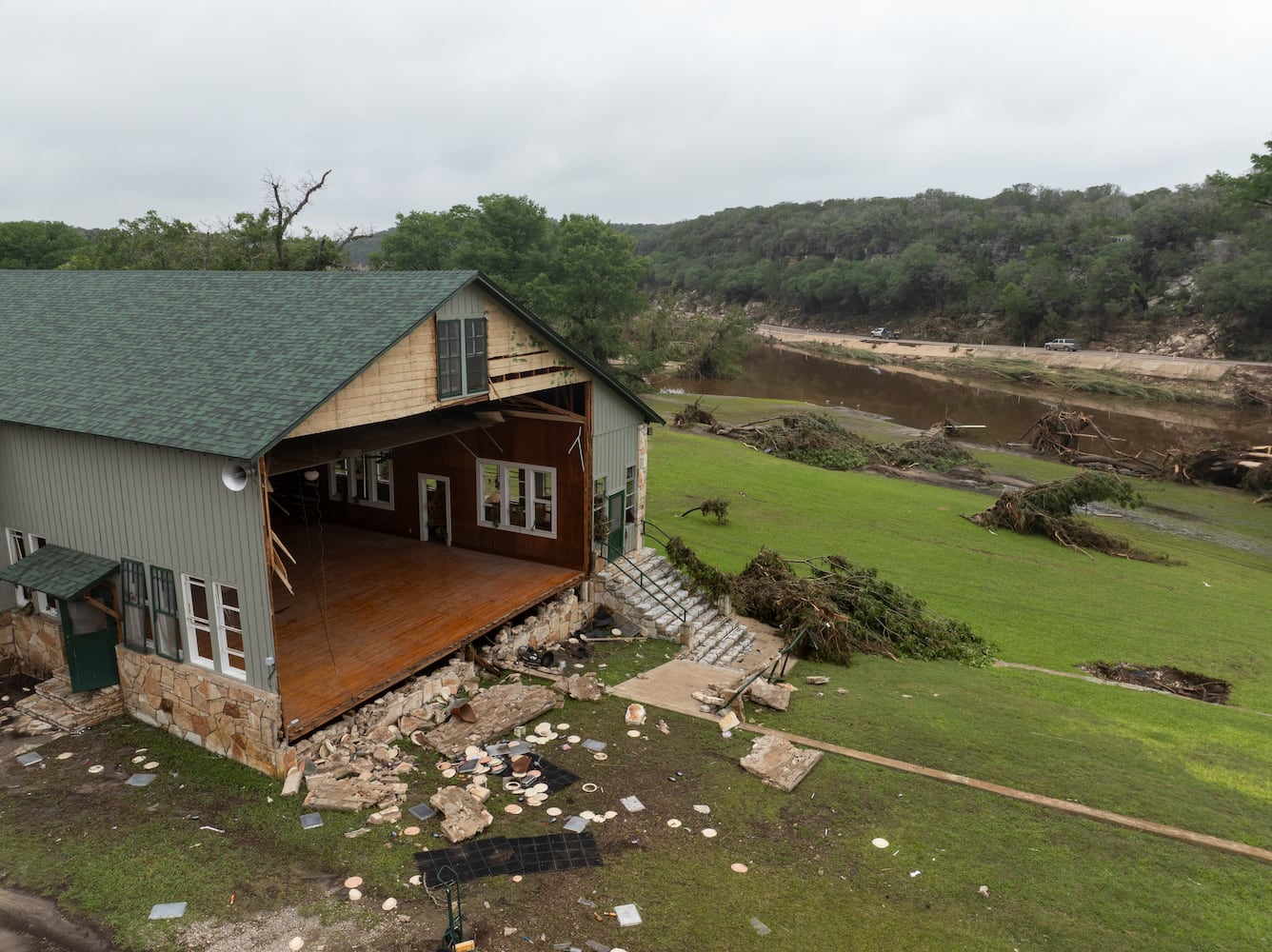 A damaged hall at Camp Mystic on the South Fork Guadalupe River, right, in Hunt, Texas, on Saturday, July 5, 2025. (Carter Johnston/The New York Times)