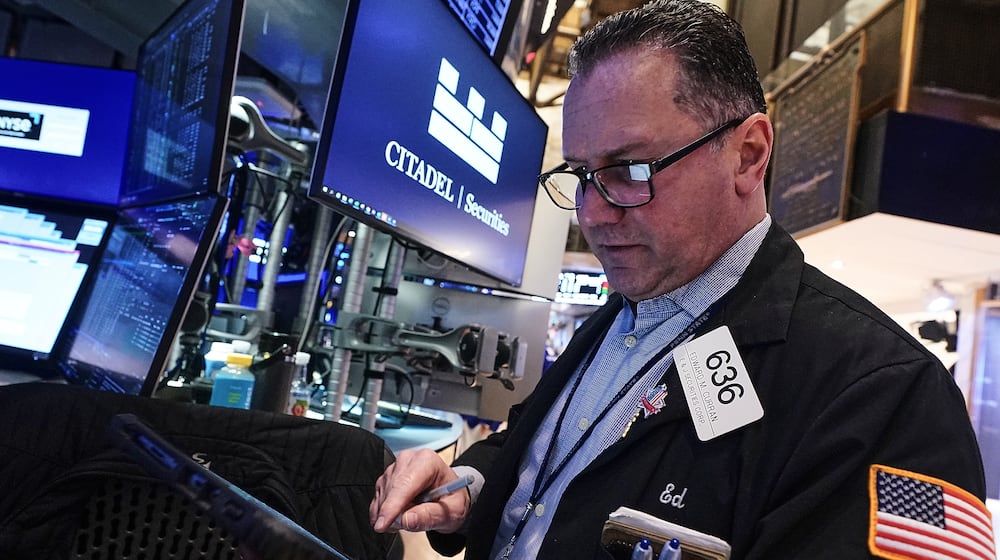 Trader Edward Curran works on the floor of the New York Stock Exchange, Thursday, Jan. 22, 2026. (AP Photo/Richard Drew)