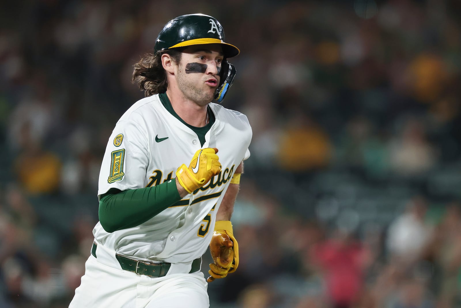Athletics' Jacob Wilson runs after hitting an RBI double during the third inning of a baseball game against the Cincinnati Reds, Saturday, Sept. 13, 2025, in West Sacramento, Calif. (AP Photo/Sara Nevis)