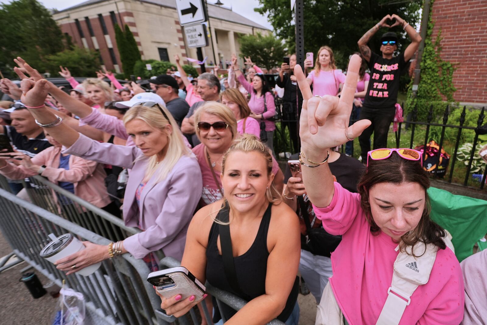 Supporters of Karen Read gesture as Read departs Norfolk Superior Court for the day during jury deliberations at her trial, Tuesday, June 17, 2025, in Dedham, Mass. (AP Photo/Charles Krupa)