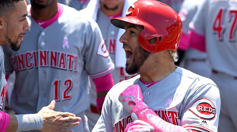 LOS ANGELES, CA - MAY 13: Eugenio Suarez #7 of the Cincinnati Reds is greeted in the dugout after a two run home run in the third inning of the game against the Los Angeles Dodgers at Dodger Stadium on May 13, 2018 in Los Angeles, California. (Photo by Jayne Kamin-Oncea/Getty Images)