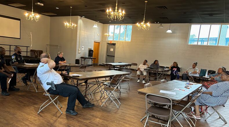 Several members of the Middletown Division of Police, including Chief David Birk, met with NAACP members Tuesday night at the Robert "Sonny" Hill Jr. Community Center. RICK McCRABB/STAFF