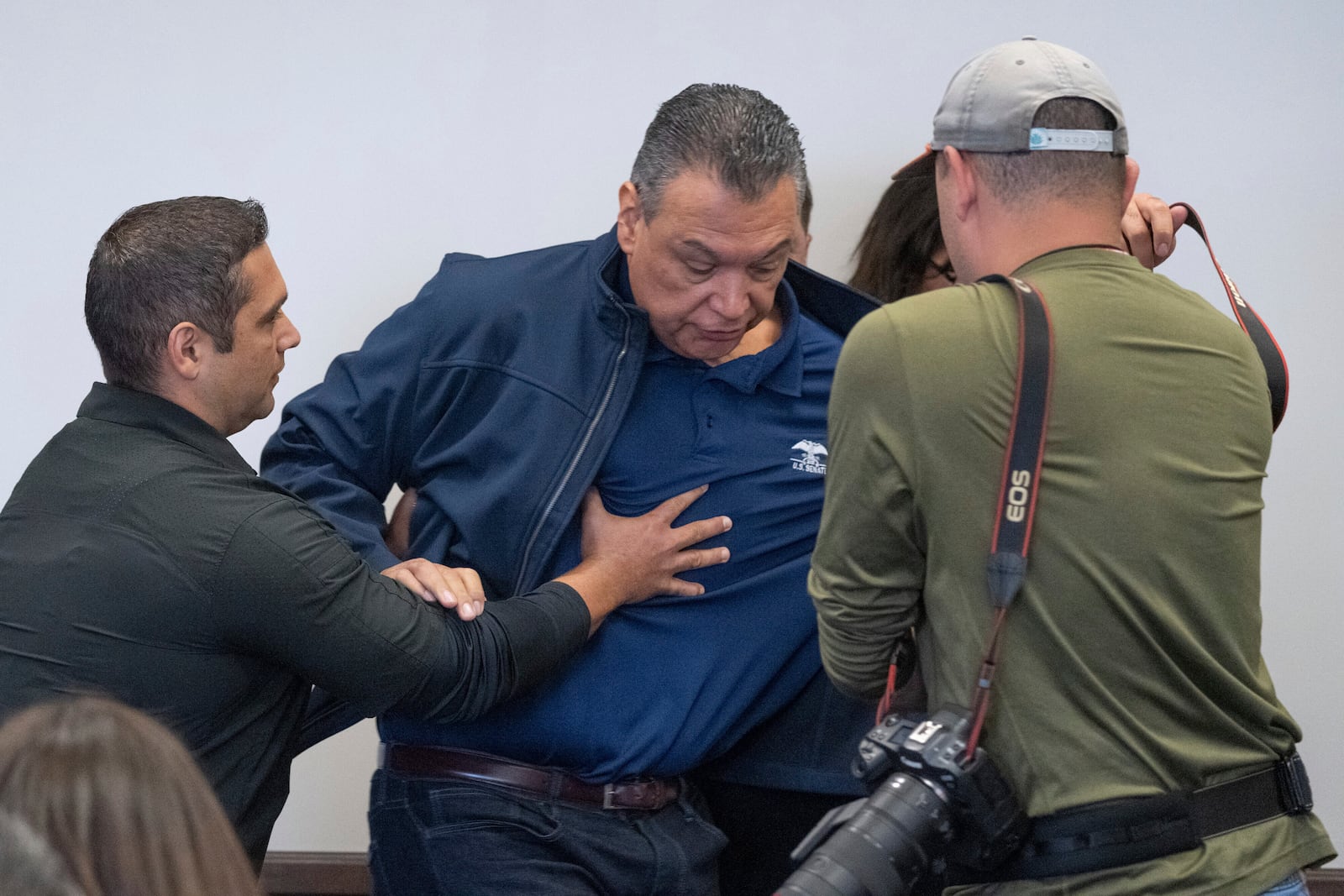 U.S. Sen. Alex Padilla, D-Calif., is pushed out of the room as Homeland Security Secretary Kristi Noem holds a news conference regarding the recent protests in Los Angeles, Thursday, June 12, 2025. (David Crane/The Orange County Register via AP)