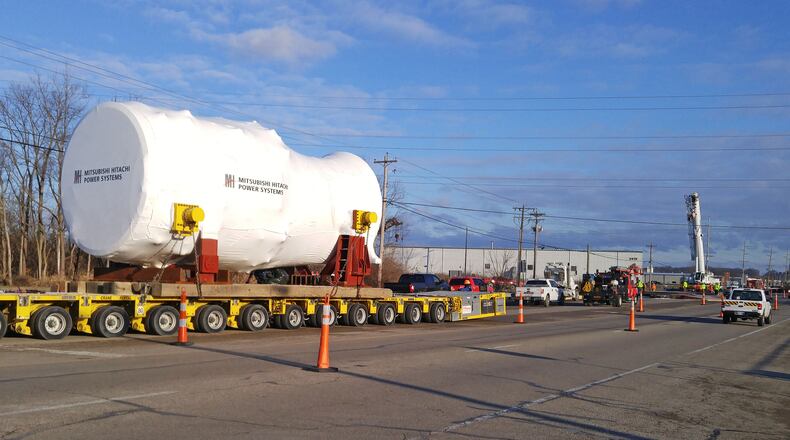 Contractors slowly moved an extremely heavy load from a rail yard to the construction site of the NTE Energy plant in late December. Another heavy load will make its way through Monroe on Feb. 20. NICK GRAHAM/STAFF