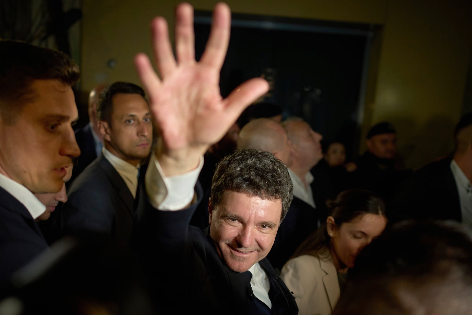 Presidential candidatee Nicusor Dan waves to supporters after winning the second round of the country's presidential election redo in Bucharest, Romania, early Monday, May 19, 2025. (AP Photo/Vadim Ghirda)