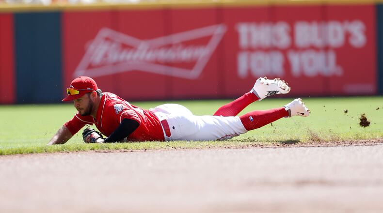 CINCINNATI, OH - SEPTEMBER 24: Eugenio Suarez #7 of the Cincinnati Reds fields a ground ball hit by Mitch Moreland of the Boston Red Sox during the second inning at Great American Ball Park on September 24, 2017 in Cincinnati, Ohio. (Photo by Kirk Irwin/Getty Images)