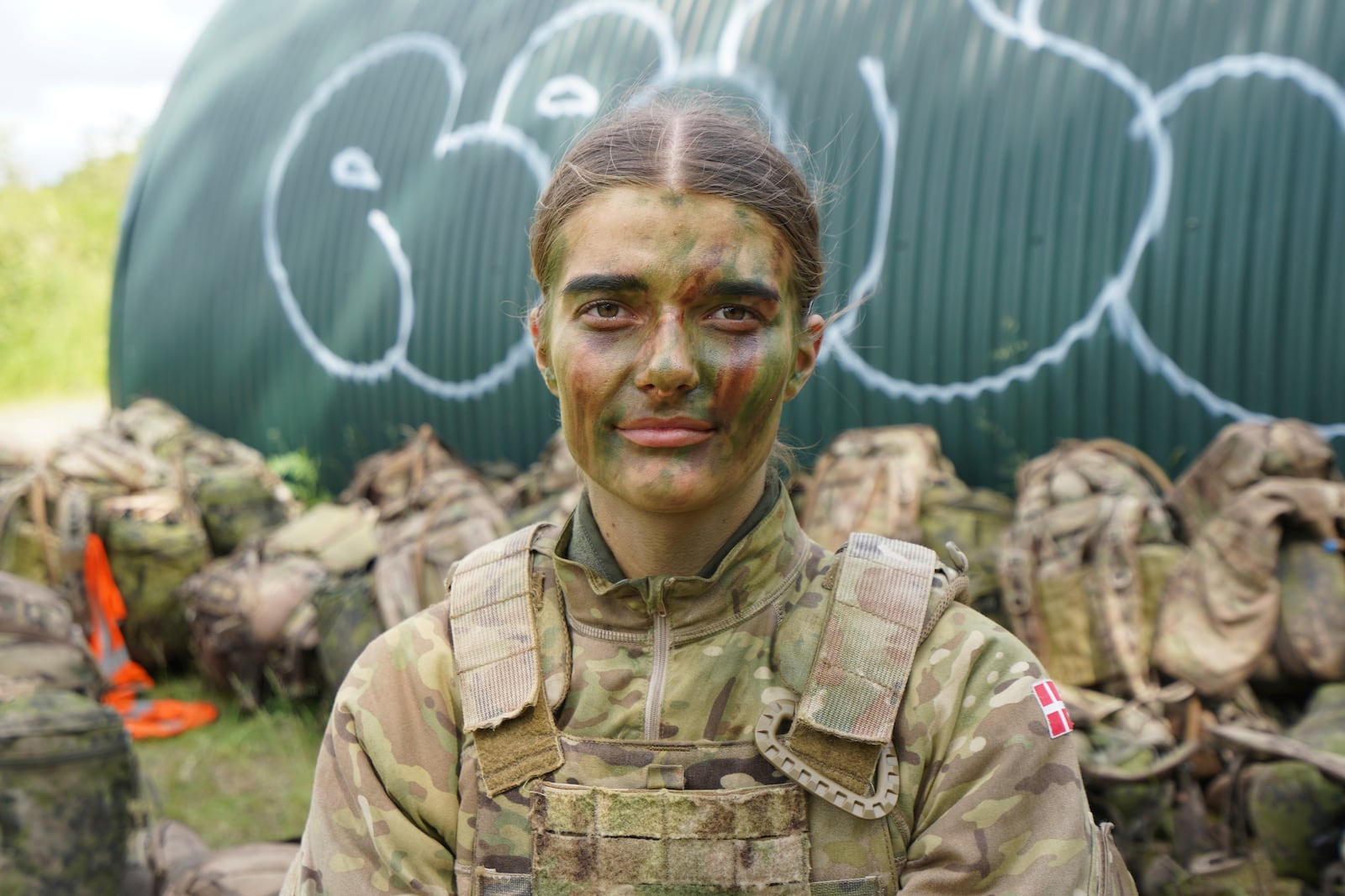 21-year-old conscript Anne Sofie poses for a photo during final exercises at a training area close to Royal Danish Army’s barracks in Hovelte, 25 kilometres north of Copenhagen, Denmark, Wednesday, June 11, 2025. (AP Photo/James Brooks)