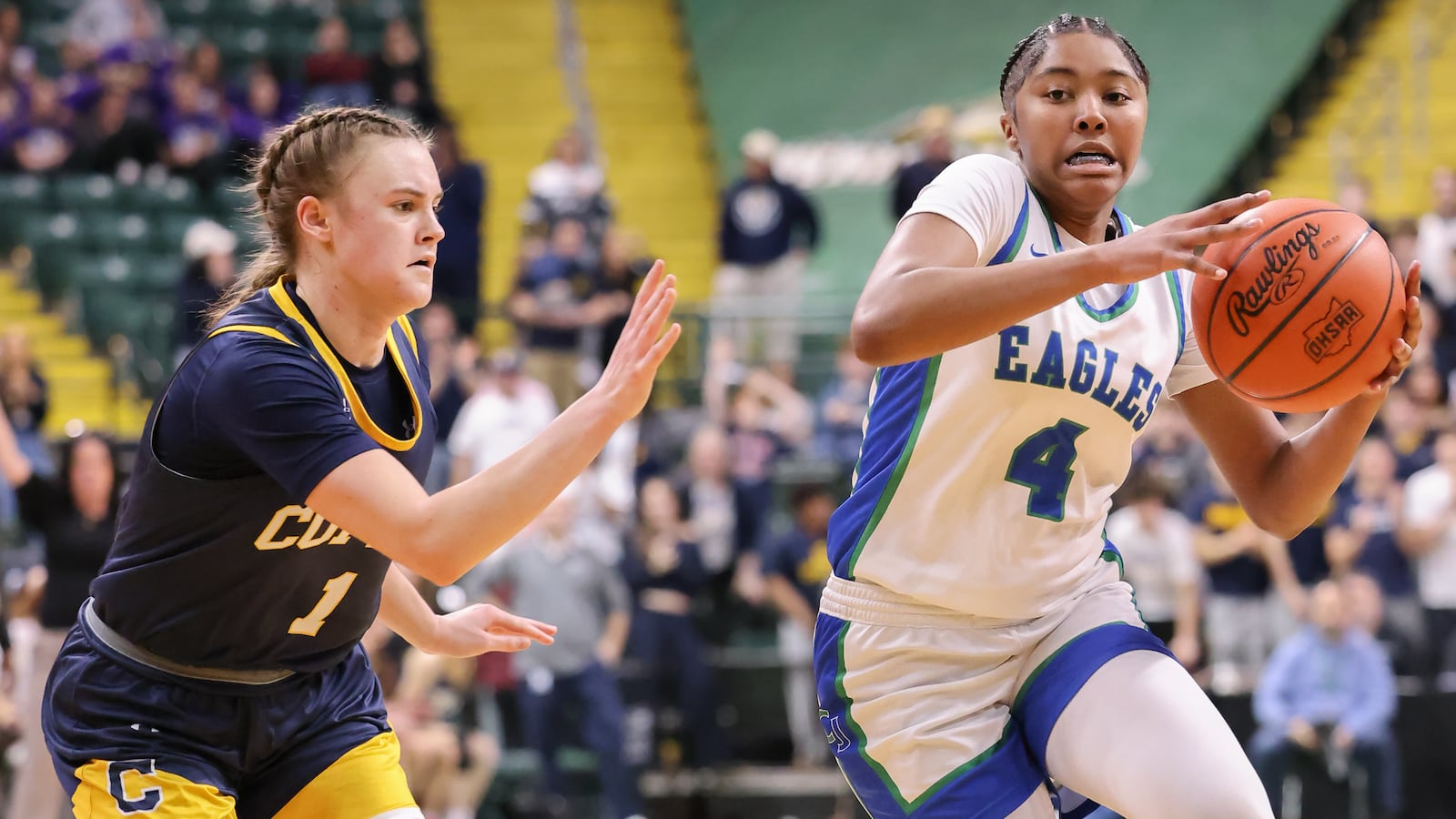 Chaminade-Julienne freshman guard Mychael Hanson dribbles with pressure from Copley's Evelyn McKnight during a Division III state semifinal on Thursday, March 12 at Ervin J. Nutter Center in Fairborn. Hanson scored 15 points, 11 of which came in the fourth quarter. BRYANT BILLING / STAFF