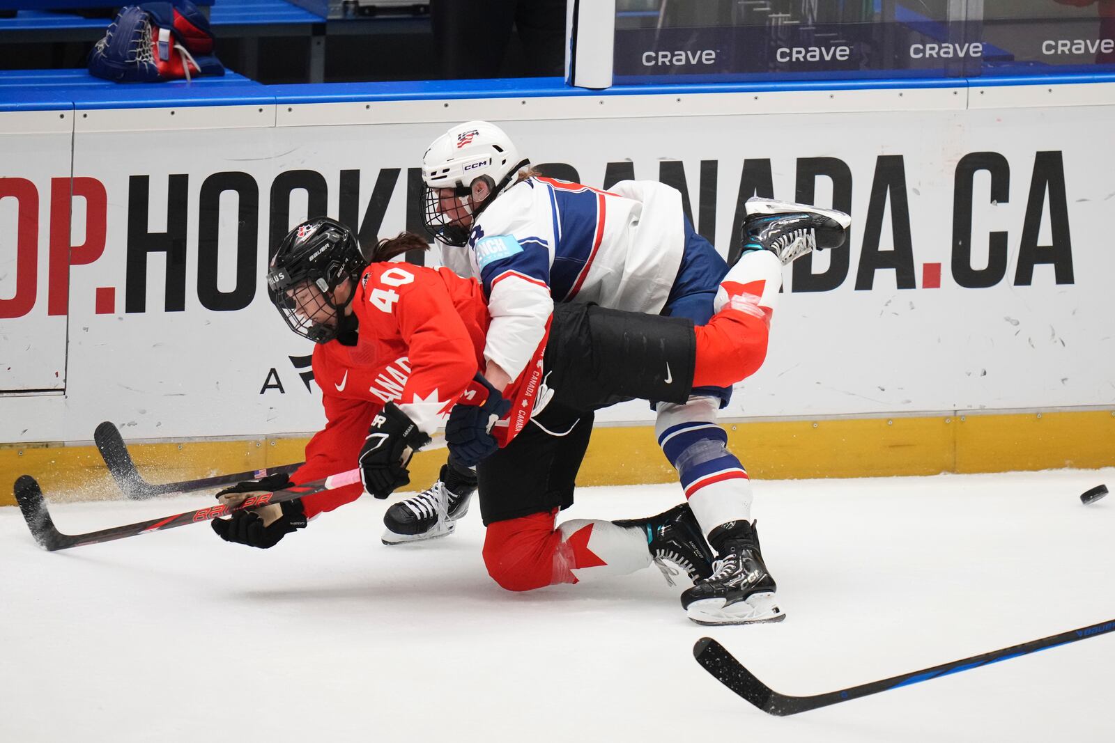 United States' Haley Winn, right, challenges Blayre Turnbull of Canada during the group A match between United States and Canada at the Women's Ice Hockey Championships in Ceske Budejovice, Czech Republic, Sunday, April 13, 2025. (AP Photo/Petr David Josek)