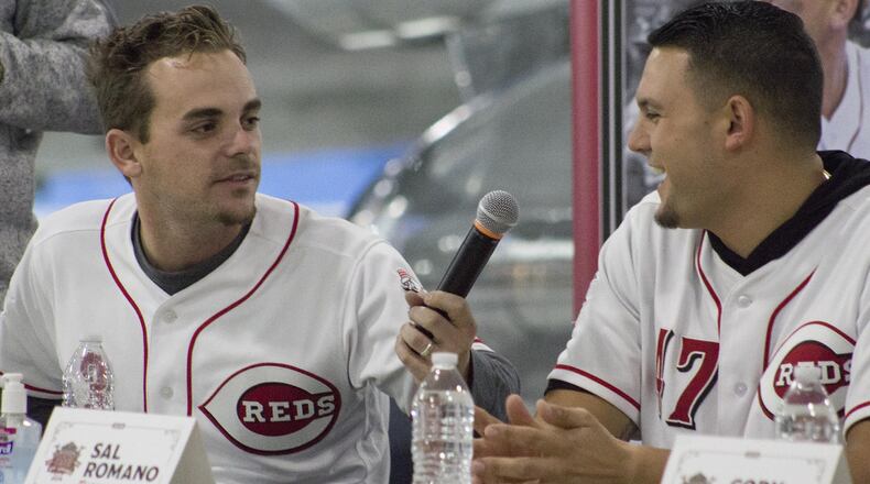 Reds second baseman Scooter Gennett (left) has fun with pitcher Sal Romano during the Q and A session at Saturday’s Reds Caravan stop at the Air Force Museum. Jeff Gilbert/CONTRIBUTED
