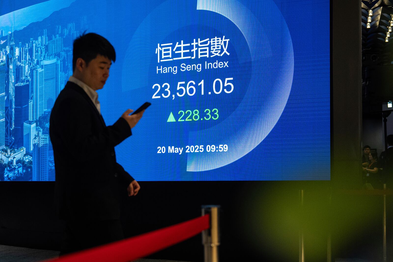 Hang Seng Index is displayed on the digital screen at the listing ceremony of Contemporary Amperex Technology Co. (CATL) in Hong Kong, Tuesday, May 20, 2025. (AP Photo/Chan Long Hei)