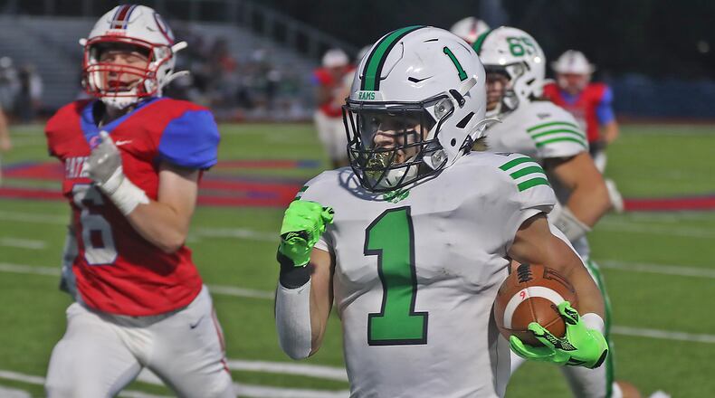 Badin's Carter Russo rushes for a touchdown against Carroll. BILL LACKEY/STAFF