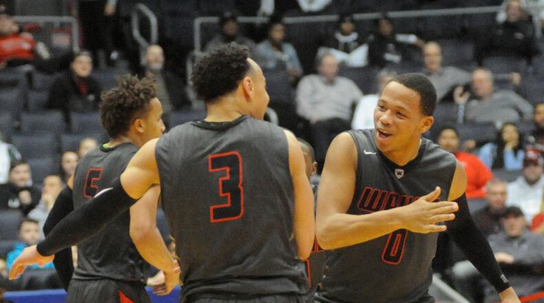 Darius Quisenberry (left) and Rashad McKee of Wayne during a district final defeat of Oak Hills at UD Arena on Saturday. MARC PENDLETON / STAFF