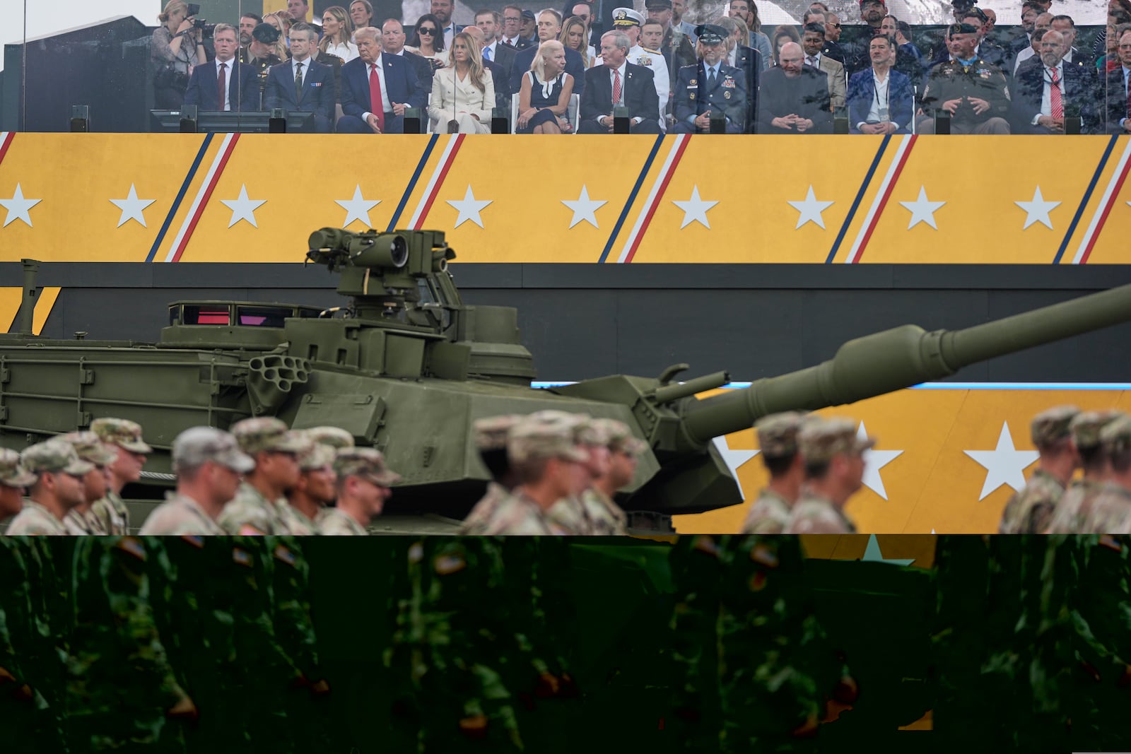 President Donald Trump, first lady Melania Trump and other guests attend a military parade commemorating the Army's 250th anniversary, coinciding with his 79th birthday, Saturday, June 14, 2025, in Washington. (AP Photo/Julia Demaree Nikhinson)