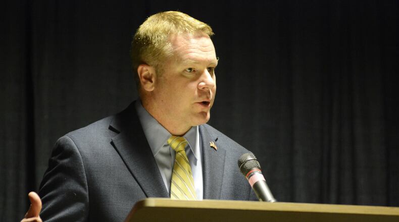 U.S. Rep. Warren Davidson, R-Troy, talks to a capacity crowd on Saturday evening, March 11, 2017, at the Butler County GOP Lincoln Day Dinner at the Oscar Event Center in Fairfield. MICHAEL D. PITMAN/STAFF
