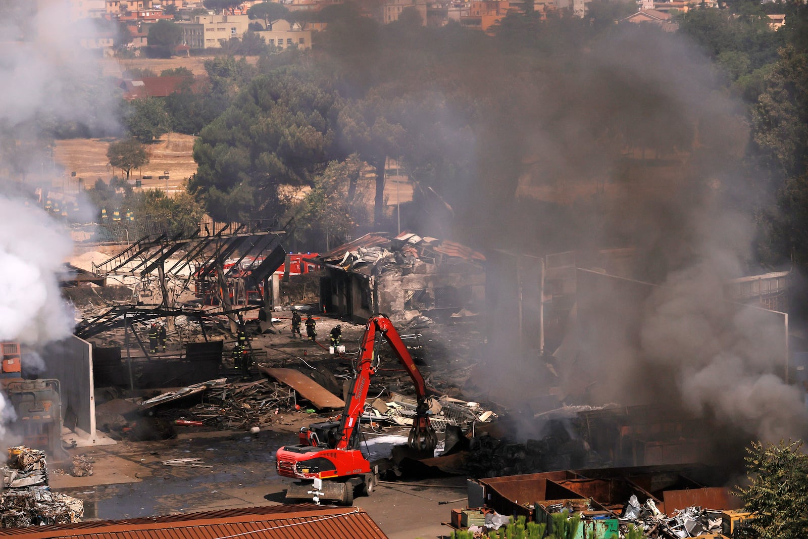 Firefighters at the scene of an explosion at a gas station in Rome, Italy, Friday, July 4, 2025. (Cecilia Fabiano/LaPresse via AP)