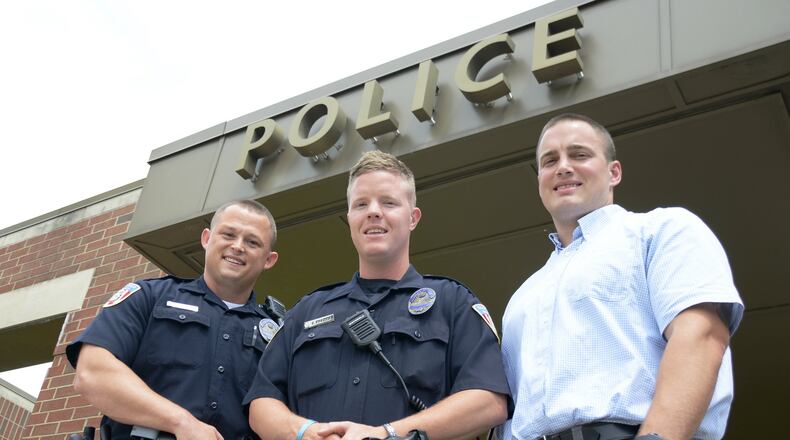 Fairfield Police Department has hired three new officers, two of whom are in their training time. Jeremiah Taylor, 33, (left) and Conner Frazier, 26, (center) are currently assigned to field training officers for the next few months, and Darin Gooch, 28, will start his police officer training program this month with the Ohio State Highway Patrol. MICHAEL D. PITMAN/STAFF