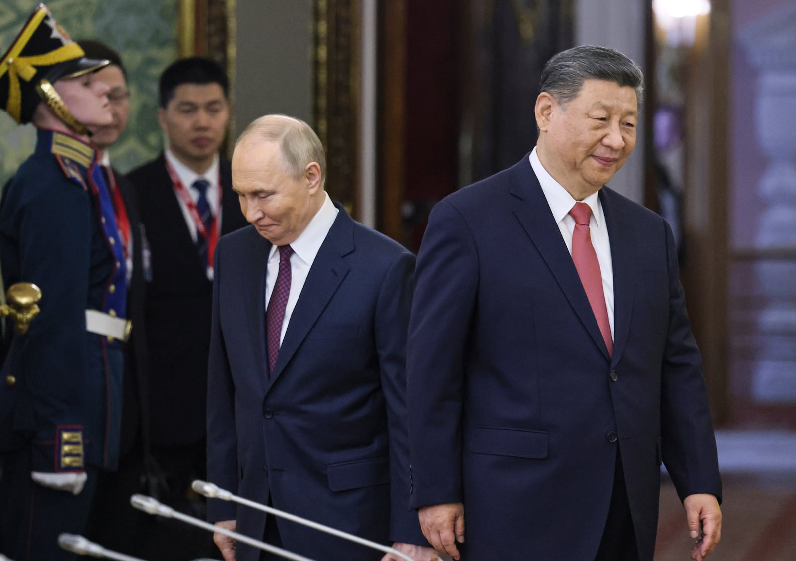 Russian President Vladimir Putin, center left, and China's President Xi Jinping, right, arrive for their talks at the Kremlin in Moscow, Russia, Thursday, May 8, 2025, ahead of celebrations of the 80th anniversary of the Soviet Union's victory over Nazi Germany during the World War II. (Yuri Kochetkov/Pool Photo via AP)