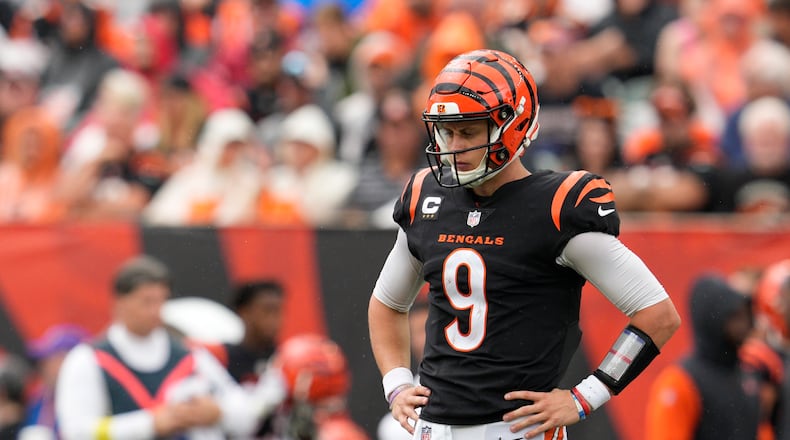 Cincinnati Bengals quarterback Joe Burrow (9) pauses between plays during the first half of an NFL football game against the Pittsburgh Steelers, Sunday, Sept. 11, 2022, in Cincinnati. (AP Photo/Jeff Dean)