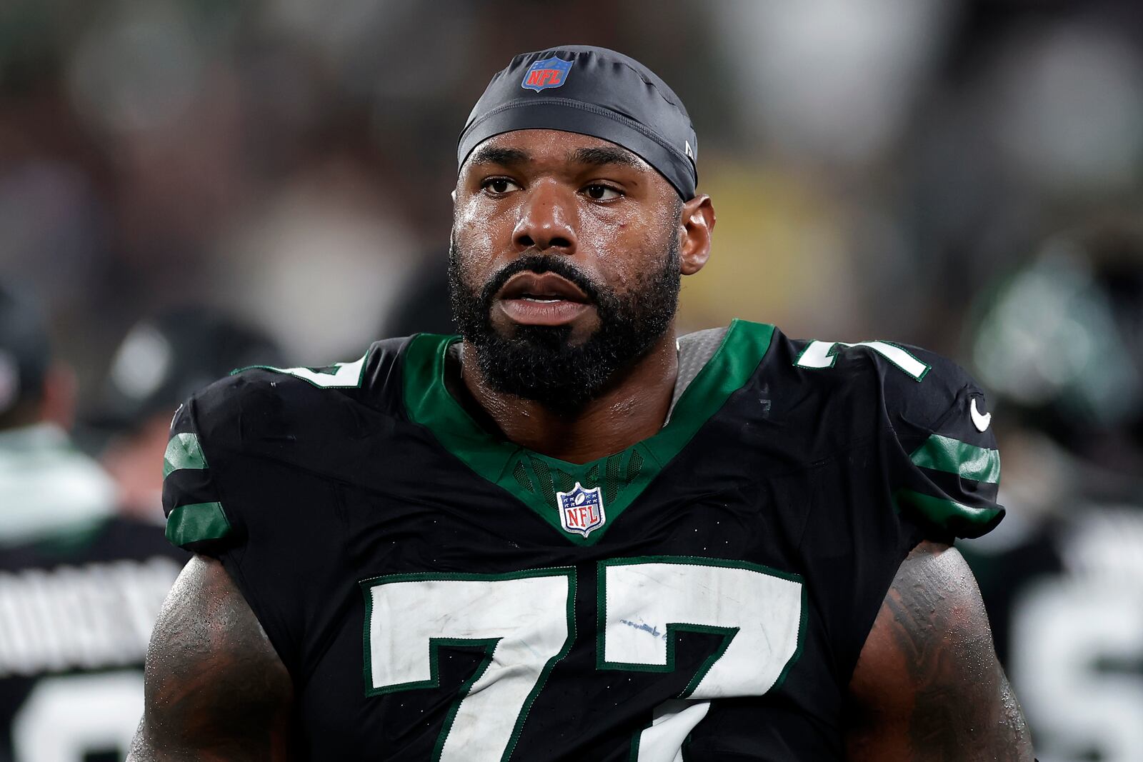 FILE - New York Jets offensive tackle Tyron Smith (77) reacts during an NFL football game against the Houston Texans Thursday, Oct. 31, 2024, in East Rutherford, N.J. (AP Photo/Adam Hunger, File)
