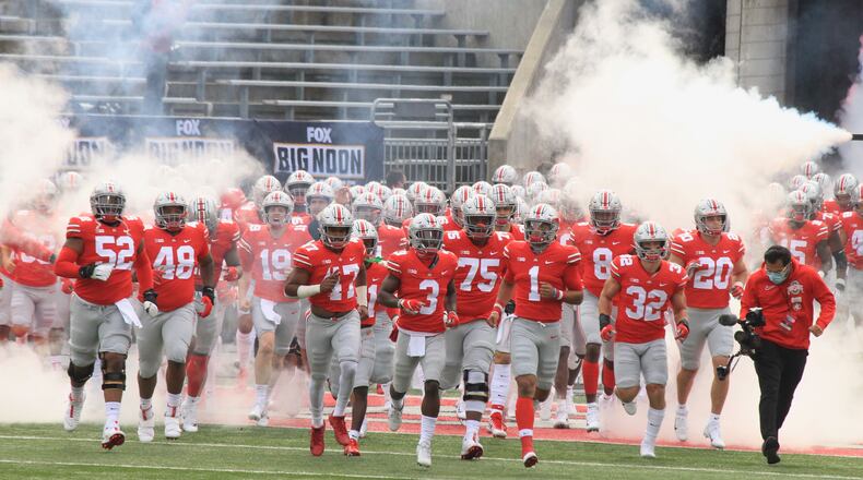 Ohio State runs onto the field before a game against Nebraska on Saturday, Oct. 24, 2020, at Ohio Stadium in Columbus. David Jablonski/Staff