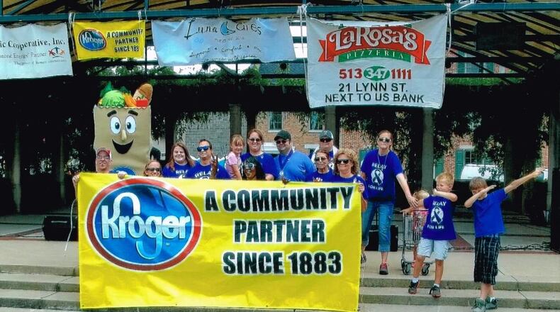 Oxford’s Kroger store was recognized by the company s Cincinnati Division for raising the largest total of any single store in the Cincinnati, Dayton and Northern Kentucky area for Relay for Life this year. Employees and their mascot Baggster pose on the Uptown performance pavilion during the June 24 event. Relay moved Uptown this year and had a successful day of activities. CONTRIBUTED