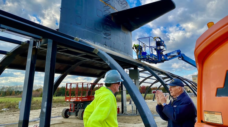Bob Viney (right), vice president & program executive of the Submarine Cincinnati Memorial Association, discusses memorial site with construction official. The Cold War memorial is scheduled to open in May 2026. (Photo By Michael D. Clark/Journal-News)