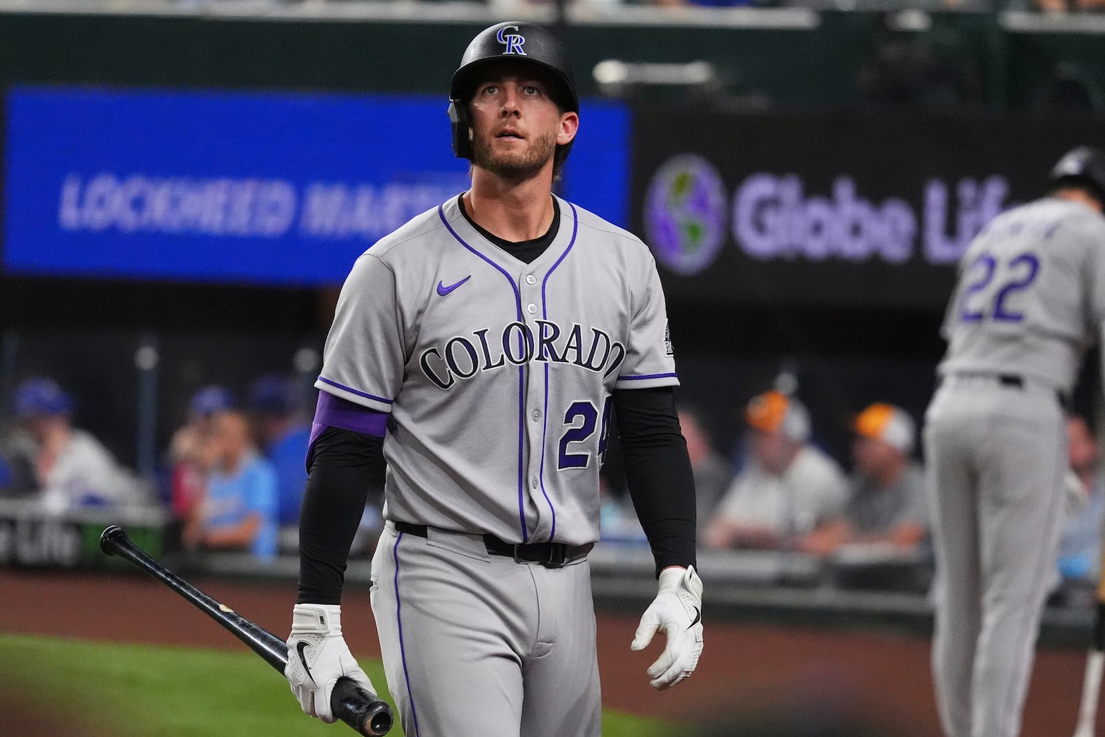 Colorado Rockies' Ryan McMahon walks to the dugout after striking out during the ninth inning of a baseball game against the Texas Rangers, Wednesday, May 14, 2025, in Arlington, Texas. (AP Photo/LM Otero)