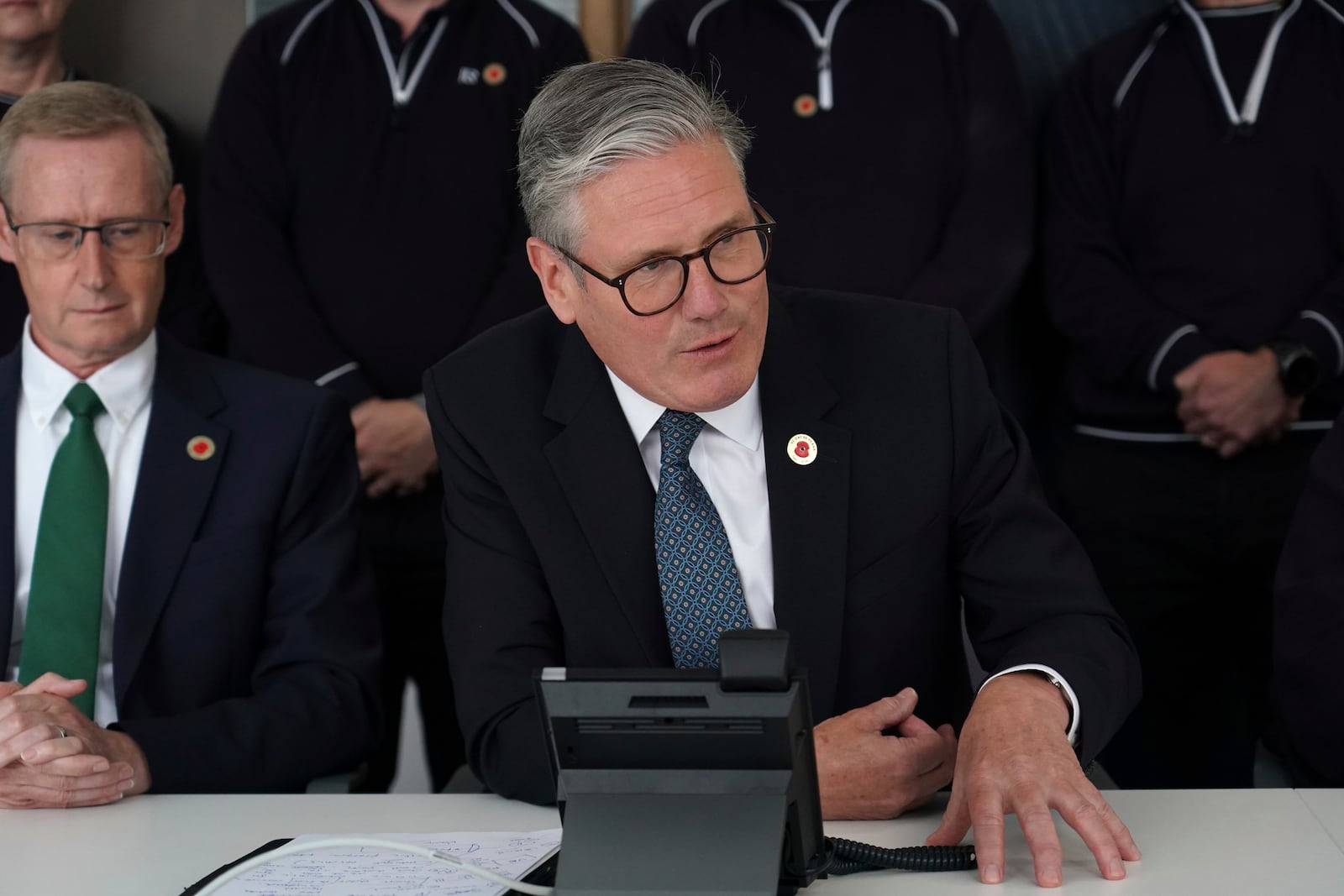 Britain's Prime Minister Keir Starmer speaks on the phone to US President Donald Trump at a car factory in the West Midlands, Thursday, May 8, 2025.(AP Photo/Alberto Pezzali, Pool)