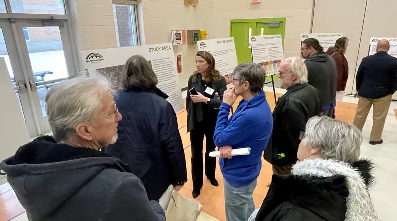 Scores of residents from Hamilton and neighboring communities attended the north Hamilton Crossing open house at Fairgrove Elementary in Hamilton Monday evening, Jan. 23, 2023. Attendees viewed the several alternative options for routes to cross the Great Miami River to create a new east-west access for traffic. In addition to informational, posters, officials from the city, the Ohio Department of Transportation, and the project management firm Stantec were available to answer questions and address comments. MICHAEL D. PITMAN/STAFF