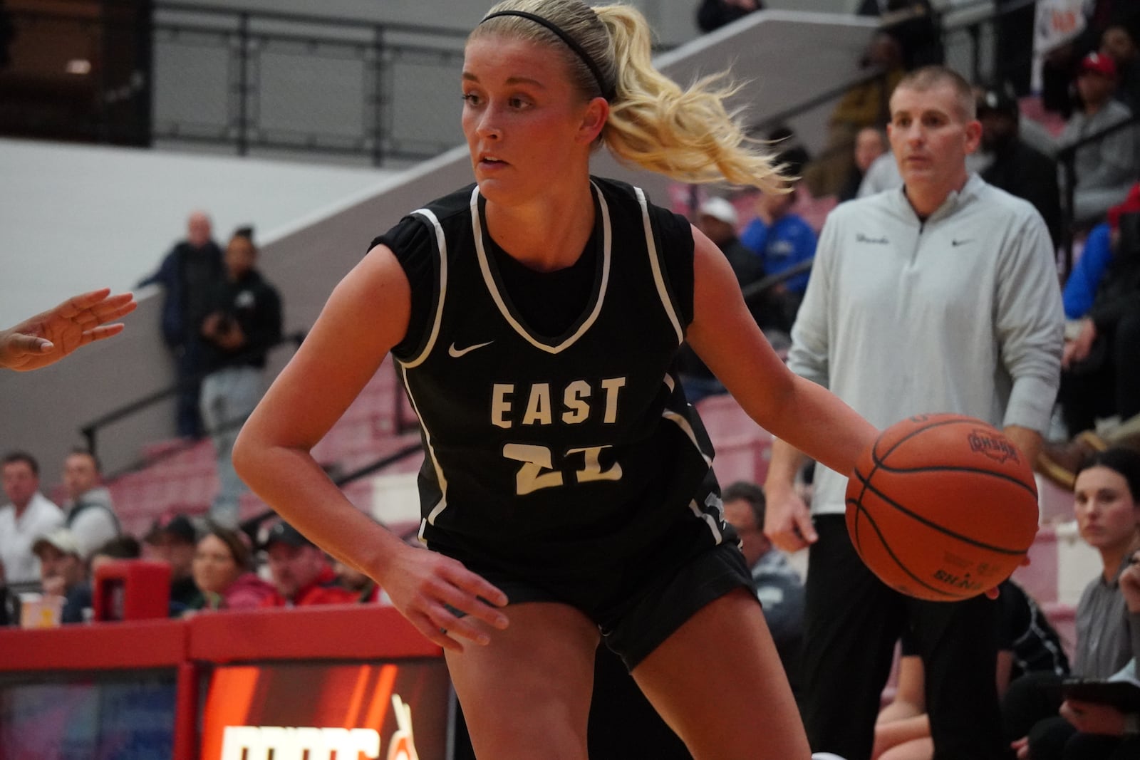 Lakota East's Bella Sturgill dribbles the ball into the lane during her Division I district semifinal game against Walnut Hills on Monday night at Fairfield Arena. CHRIS VOGT / CONTRIBUTED