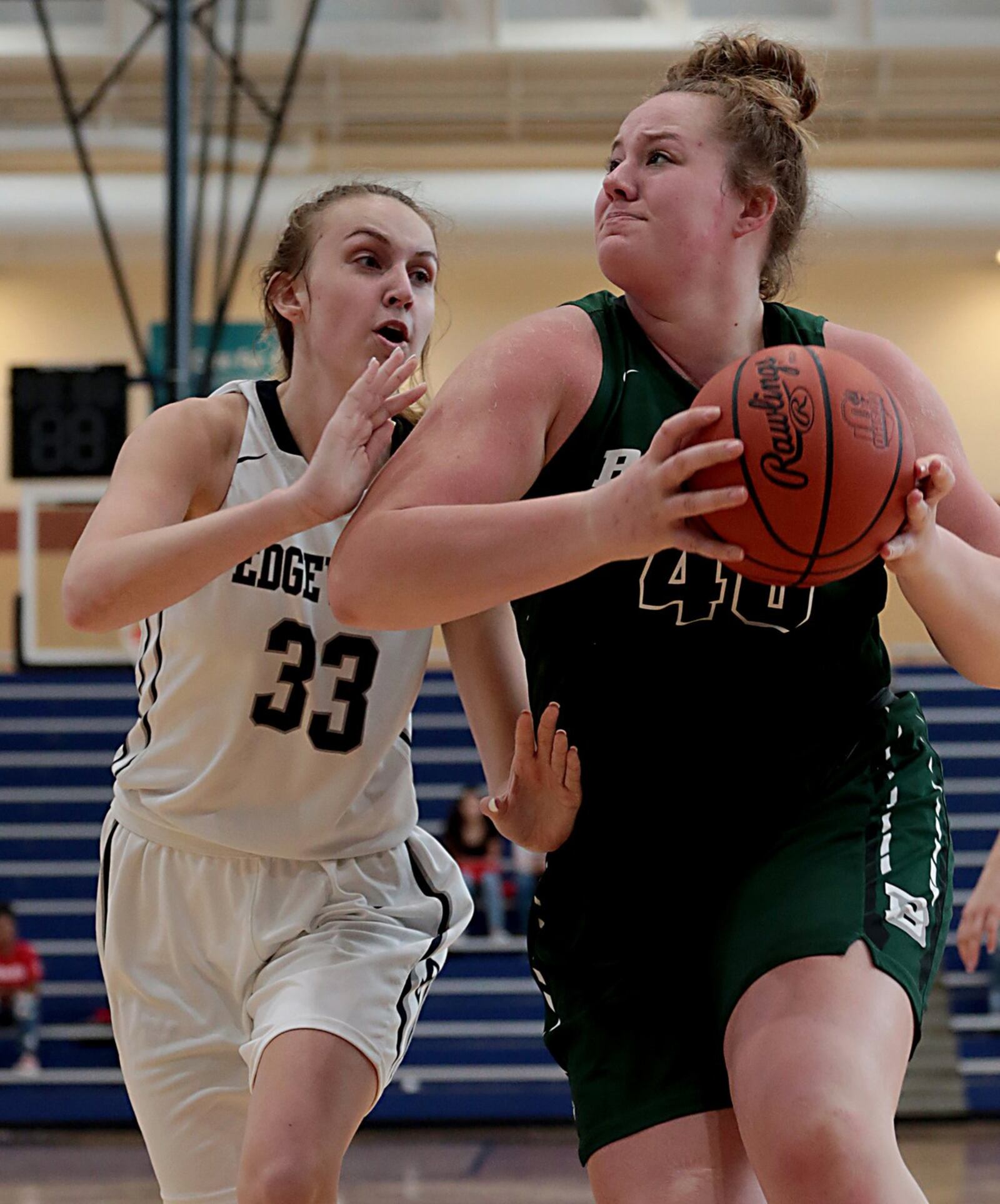 Badin’s Emma Broermann (40) puts a move on Edgewood’s Callie Hunt (33) on Saturday during the third annual All-Butler County All-Star girls basketball game at the Hamilton Athletic Center. Hunt’s Red team defeated the Blue 41-36. CONTRIBUTED PHOTO BY E.L. HUBBARD