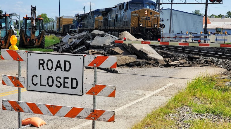 Motorists who drive State Street in Trenton must detour around the railroad tracks this week as CSX performs repairs. NICK GRAHAM/STAFF