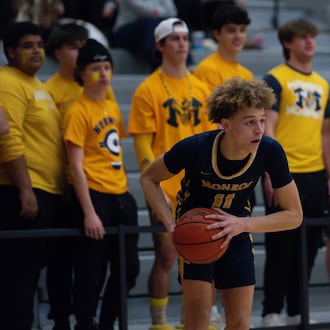 Monroe's Bryant Lee looks for a passing lane during his Division III tournament game against Northwest on Thursday, Feb. 26, 2026 at Princeton High School. AJ FULLAM / CONTRIBUTED